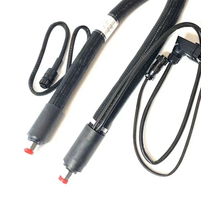 Black insulated hot melt adhesive hoses with electrical connectors and protective mesh covering.