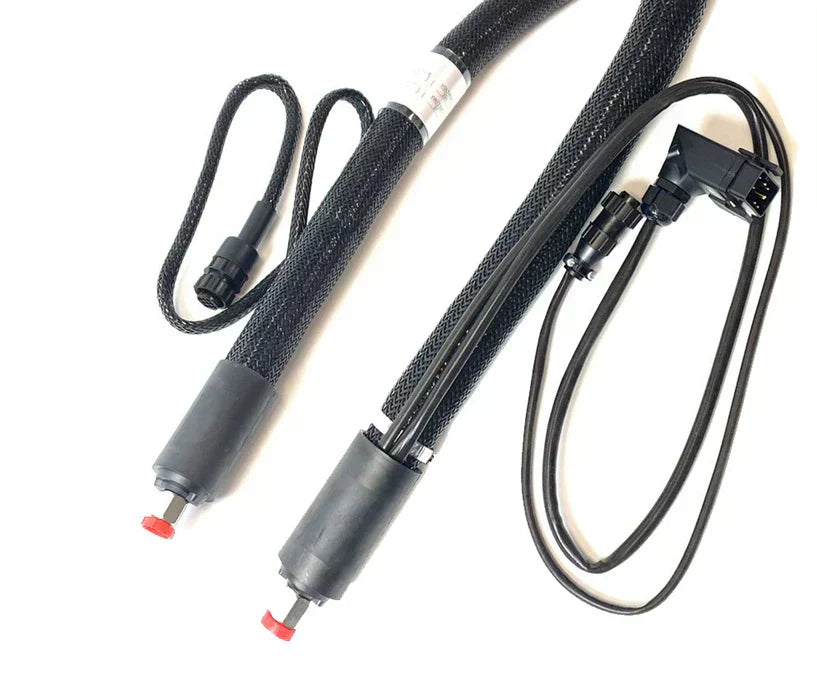 Black insulated hot melt adhesive hoses with electrical connectors and protective mesh covering.