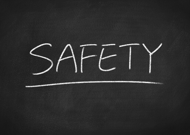 The word safety written on a chalkboard highlighting five tips for glue gun Safety.